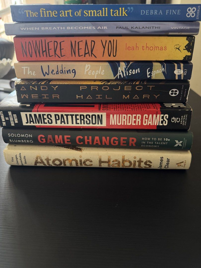Assorted Bestselling Fiction and Non-Fiction Paperbacks (Category: Storybooks) located in Mandaluyong City. Submitted by trinket.ph (Listing ID 1466774015, Image 1). Description: - Set of 8 popular paperback books sold as a bundle - Titles include: Atomic Habits, Project Hail Mary, When Breath Becomes Air, Murder Games, The Fine Art of Small Talk, Nowhere Near You, The Wedding People, and Game Changer - Condition: Read once, with minimal shelf we