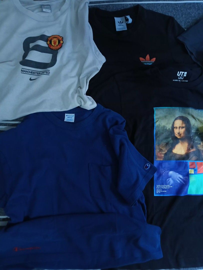 Assorted Vintage and Graphic T-Shirts Bundle (Category: Tshirts & Polo Shirts ) located in Manila. Submitted by kiksfoekd (Listing ID 1466575909, Image 3). Description: - Bundle of assorted graphic and sports t-shirts sold as a complete set - Includes top brands: Nike, Adidas, Champion, Uniqlo UT, Kelme, and New Balance - Variety of styles: casual everyday tees, football jerseys, and artistic prints (e.g., Mona Lisa) - Colors: Blue, black, white,
