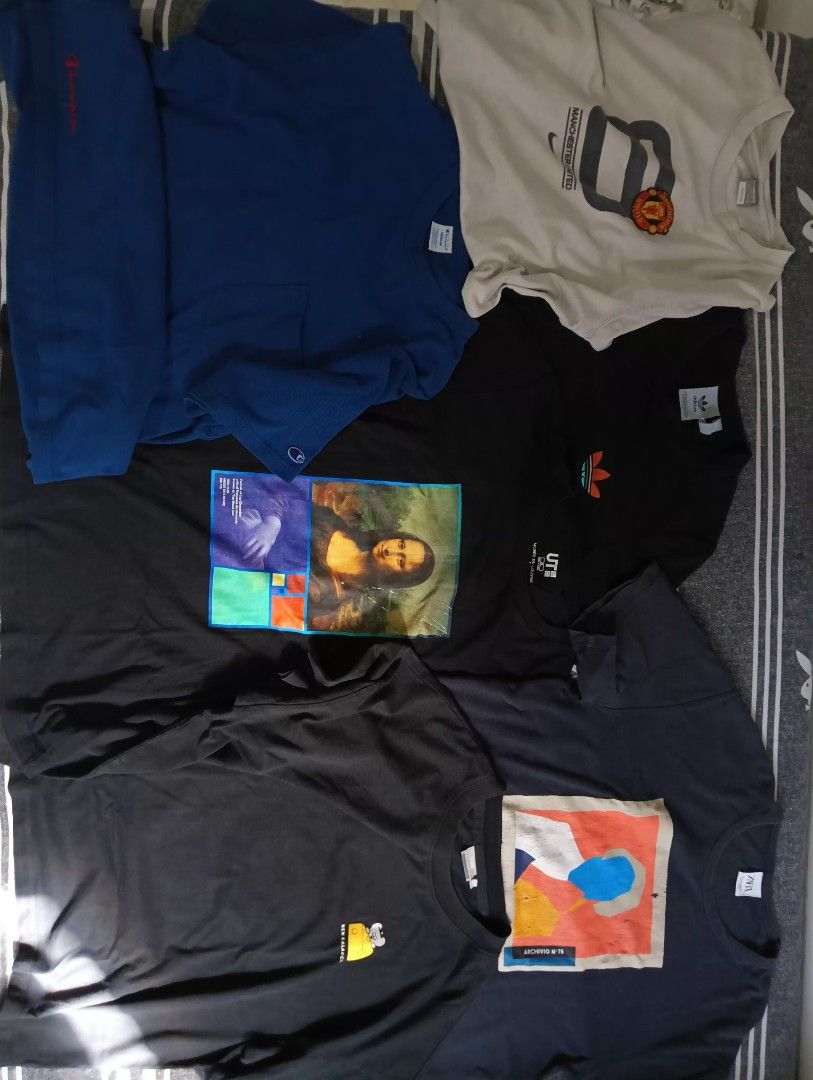 Assorted Vintage and Graphic T-Shirts Bundle (Category: Tshirts & Polo Shirts ) located in Manila. Submitted by kiksfoekd (Listing ID 1466575909, Image 2). Description: - Bundle of assorted graphic and sports t-shirts sold as a complete set - Includes top brands: Nike, Adidas, Champion, Uniqlo UT, Kelme, and New Balance - Variety of styles: casual everyday tees, football jerseys, and artistic prints (e.g., Mona Lisa) - Colors: Blue, black, white,