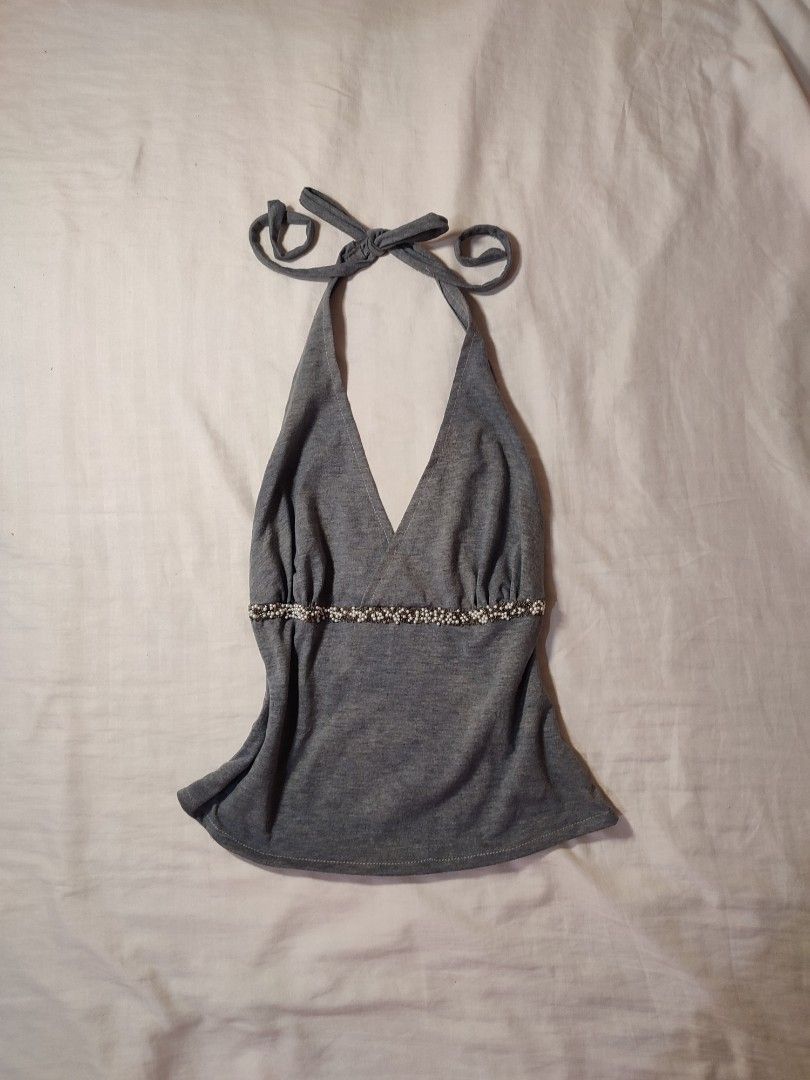 Assorted Y2K Aesthetic Cami and Halter Tops Bundle - 7 items (Category: Sleeveless) located in Jaen. Submitted by roxantiago (Listing ID 1466730565, Image 3). Description: - Wardrobe clearout: Y2K camis and halter tops - Variety of styles: Lace ruffles, beaded waistbands, cowl necks, and sequins - Neutral colors: White, grey, beige, and black - Versatile: Easy to mix and match for casual days or nights out - Purchase options: Sold individually or