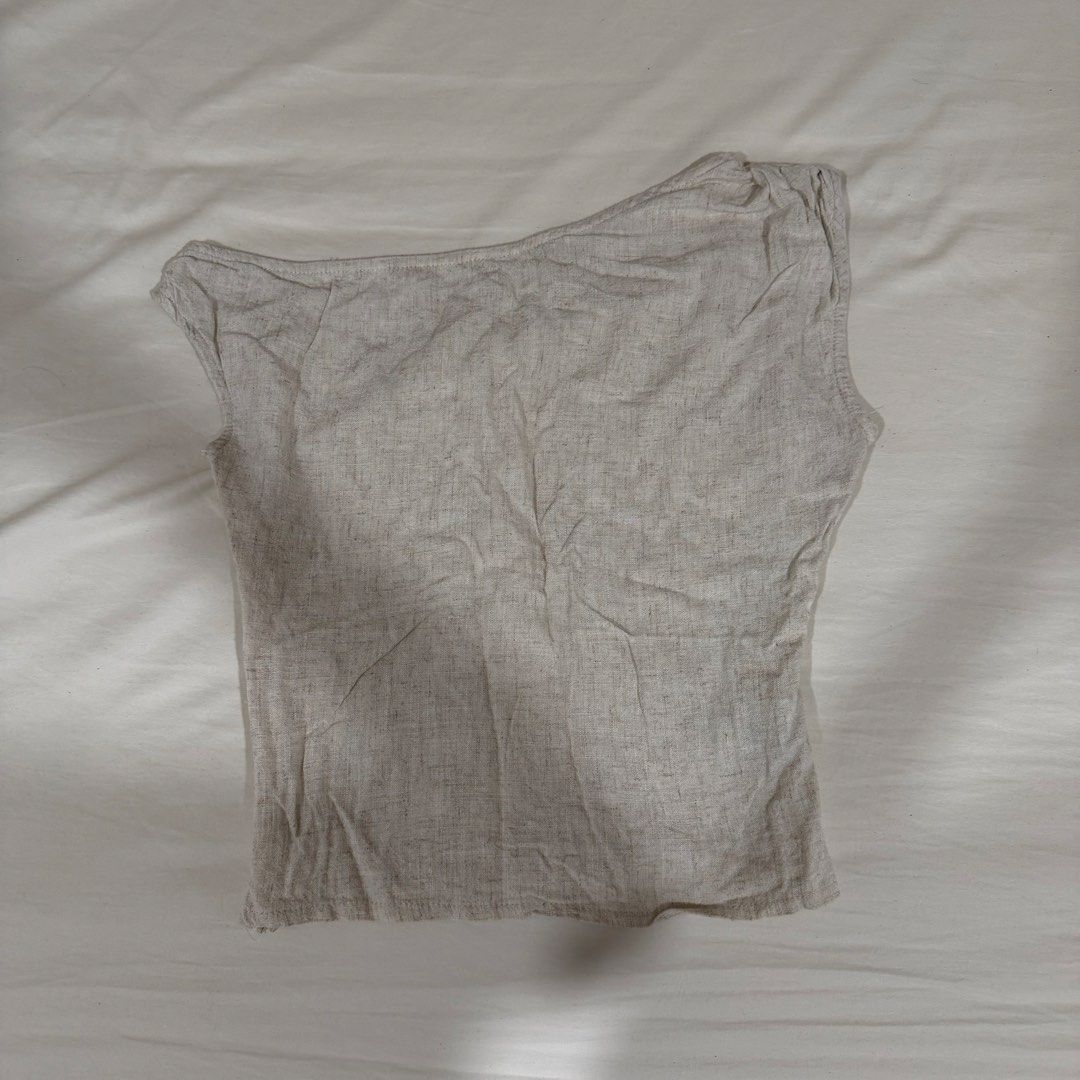 Asymmetrical Beige Linen Top (Category: Sleeveless) located in Manila. Submitted by jeanettetaneca (Listing ID 1466647698, Image 2). Description: - Color: Neutral beige / oatmeal - RFS: I don’t wear it anymore! haha but really good for chic and office outfits hehe - Last price already! NO HAGGLING PLS.