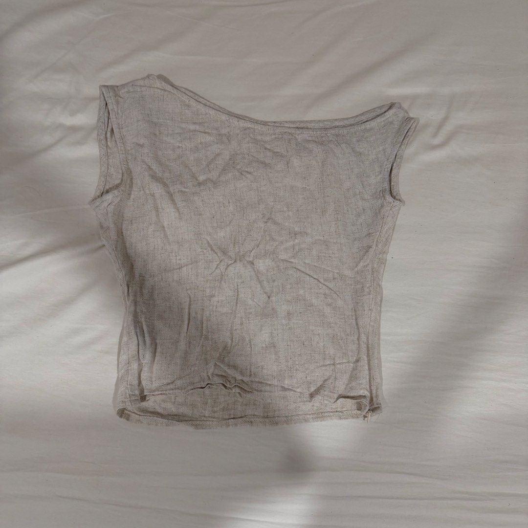 Asymmetrical Beige Linen Top (Category: Sleeveless) located in Manila. Submitted by jeanettetaneca (Listing ID 1466647698, Image 1). Description: - Color: Neutral beige / oatmeal - RFS: I don’t wear it anymore! haha but really good for chic and office outfits hehe - Last price already! NO HAGGLING PLS.