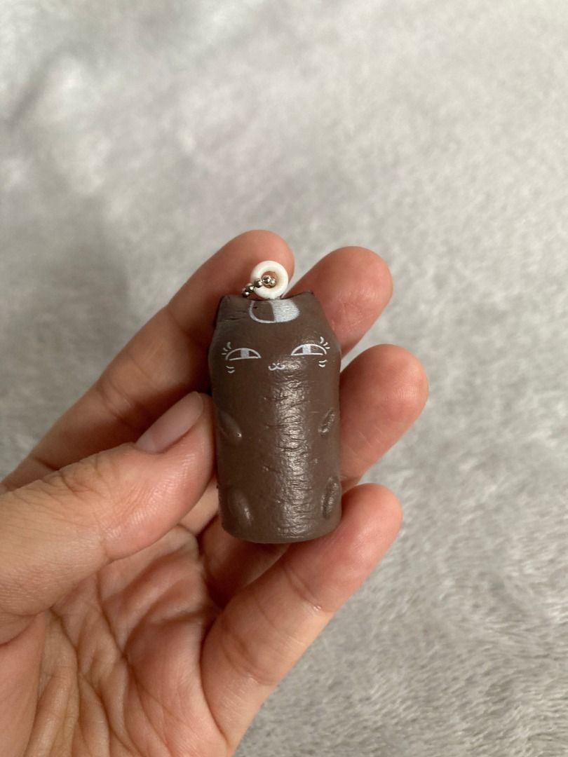 Natsume Brown Cat Squishy Keychain (Category: Character Goods) located in Rizal. Submitted by sheeraay (Listing ID 1466652723, Image 1). Description: - Brand: Takara Tomy Arts (T-ARTS) - Item: Brown cat cylinder squishy keychain.