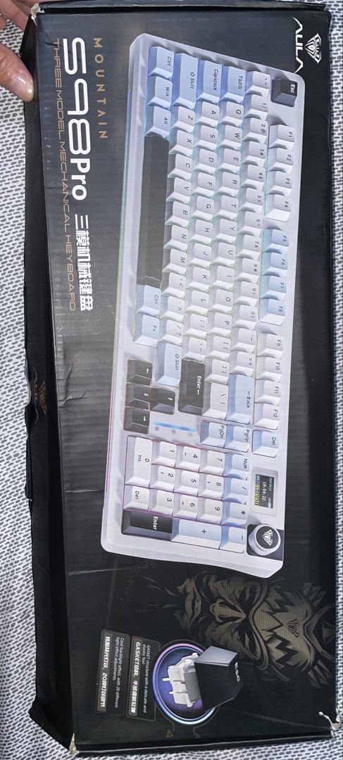 AULA Mountain S98 Pro Three Model Mechanical Keyboard (Category: Computer Keyboard) located in Cebu City. Submitted by boniita89 (Listing ID 1466773964, Image 1). Description: - Model: AULA Mountain S98 Pro Mechanical Keyboard - Colorway: White and Grey - Condition: Lightly used (once a week WFH) - Connectivity: Tri-mode (Bluetooth, 2.4G wireless, wired) - Build: Premium gasket structure for a soft, satisfying typing feel - Inclusions: Original b