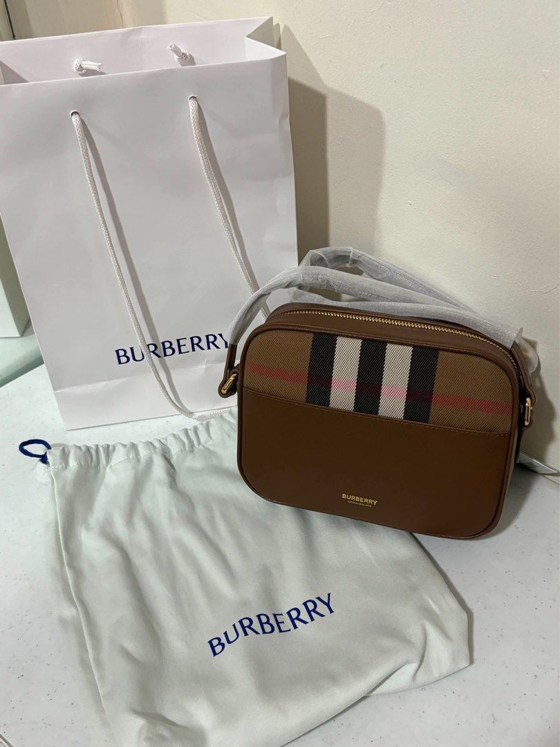 (Authentic) Burberry Camera Bag Tan Check Leather (Category: Luxury Bags & Wallets) located in Taguig. Submitted by mellowyellow21 (Listing ID 1466714010, Image 1). Description: With entrupy authenticity :) - Authentic Burberry crossbody camera bag in tan leather and signature check canvas - Complete set: includes original white dust bag, matching paper bag, and tag.