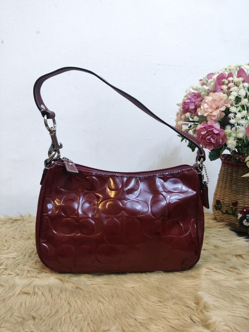 Authentic Coach demi patent kili bag (Category: Shoulder Bags) located in Rizal. Submitted by hsiri1128 (Listing ID 1466697185, Image 1). Description: 💯✔️Legit 📌From Japan Box CONDITION : 7.5/10 ISSUE / FLAWS : color transfer. check pics for details MATERIAL : Patent leather w/ silver hardwares DETAILS : fit promax and medium wallet. stand alone, spacious inside. bright red actual color.