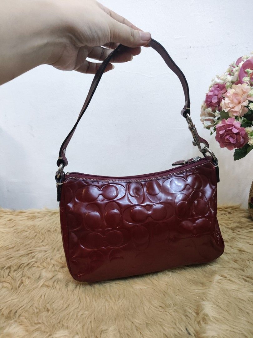 Authentic Coach demi patent kili bag (Category: Shoulder Bags) located in Rizal. Submitted by hsiri1128 (Listing ID 1466697185, Image 2). Description: 💯✔️Legit 📌From Japan Box CONDITION : 7.5/10 ISSUE / FLAWS : color transfer. check pics for details MATERIAL : Patent leather w/ silver hardwares DETAILS : fit promax and medium wallet. stand alone, spacious inside. bright red actual color.