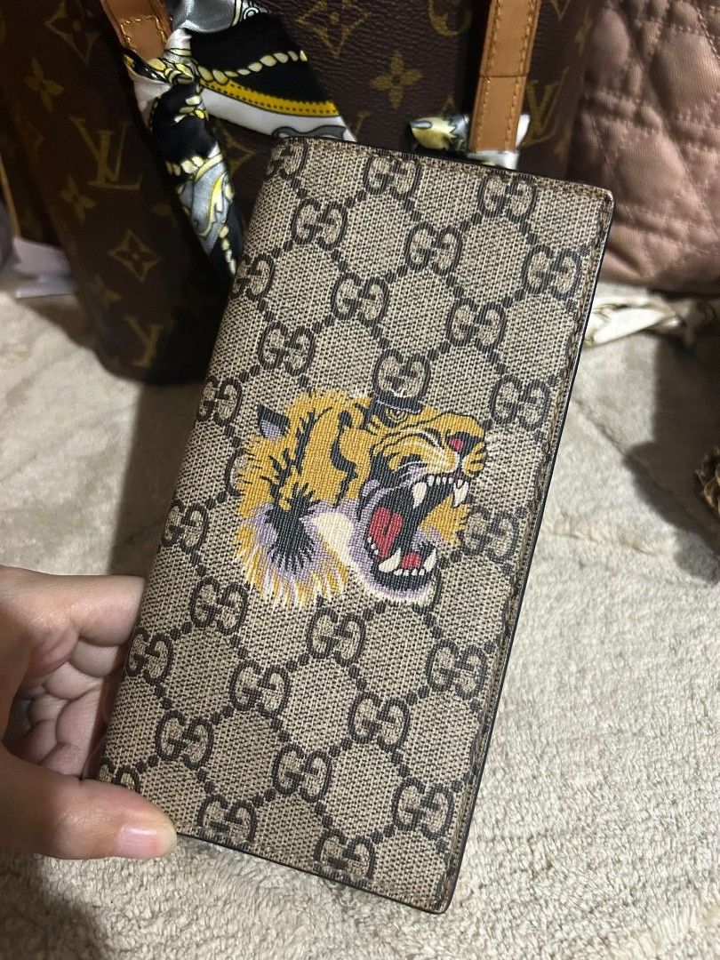 Authentic GG Tiger Medium wallet (Category: Luxury Bags & Wallets) located in Marikina City. Submitted by aussiemaan (Listing ID 1466630746, Image 1). Description: Authentic No inclusion .