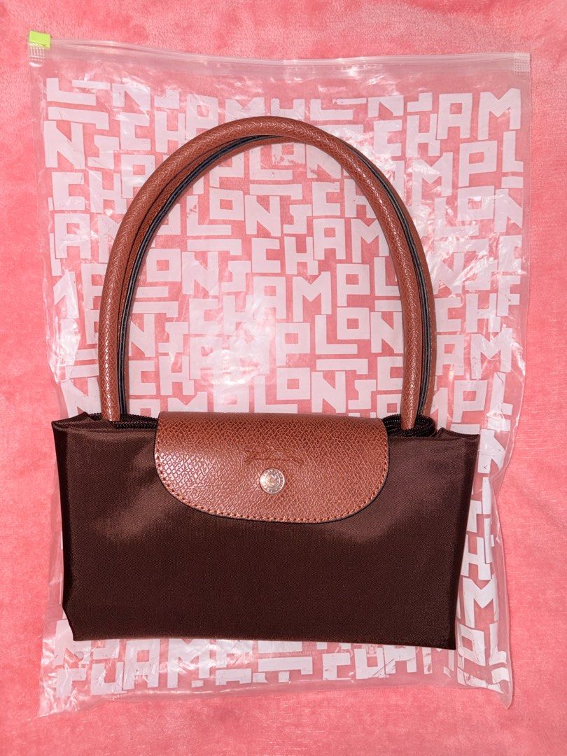 AUTHENTIC LONGCHAMP LE PLIAGE ORIGINAL L – LARGE (Category: Shoulder Bags) located in Makati City. Submitted by erica.curates (Listing ID 1466708179, Image 1). Description: AUTHENTIC LONGCHAMP LE PLIAGE ORIGINAL L – LARGE 👜 Color: Coffee/Brown Model: 1899 089 Condition: Preloved / Very Good Condition Complete with original packaging Selling Price: ₱5,500 negotiable RFS: Decluttering / not using.
