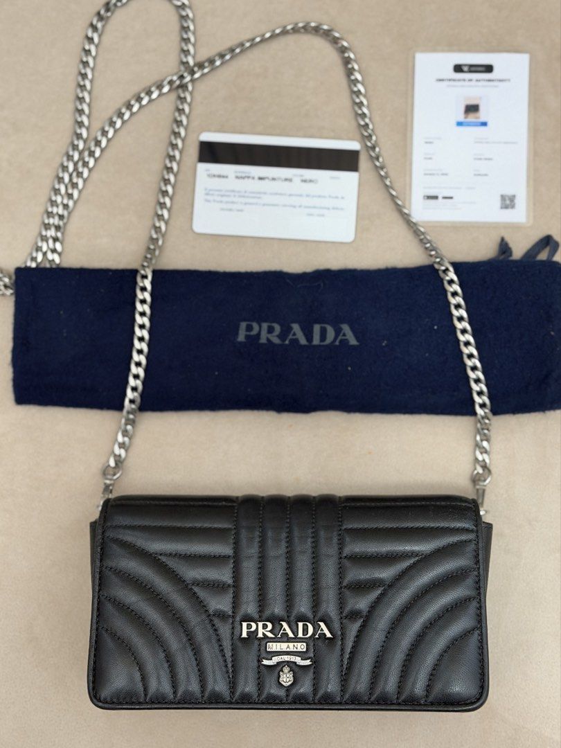 Authentic Prada Diagramme Wallet on Chain (Category: Cross-body Bags) located in Manila. Submitted by maria_2326 (Listing ID 1465994386, Image 1). Description: Prada Diagramme Wallet on Chain 💯% Authentic | fits pro max W/dust bag, chain sling, prada card, certificate of authenticity and bag organizer No lowballing! Location: Manila/QC.