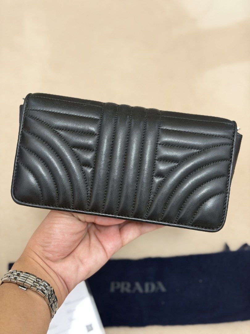Authentic Prada Diagramme Wallet on Chain (Category: Cross-body Bags) located in Manila. Submitted by maria_2326 (Listing ID 1465994386, Image 3). Description: Prada Diagramme Wallet on Chain 💯% Authentic | fits pro max W/dust bag, chain sling, prada card, certificate of authenticity and bag organizer No lowballing! Location: Manila/QC.