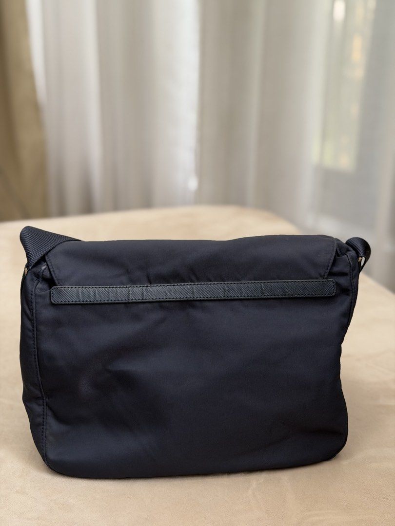 Authentic Prada Tessuto Nylon Dark Blue Messenger Bag (Category: Sling Bags) located in Manila. Submitted by maria_2326 (Listing ID 1466734628, Image 3). Description: 💯% Authentic W/ dust bag only No lowballing! Location: Manila/QC.
