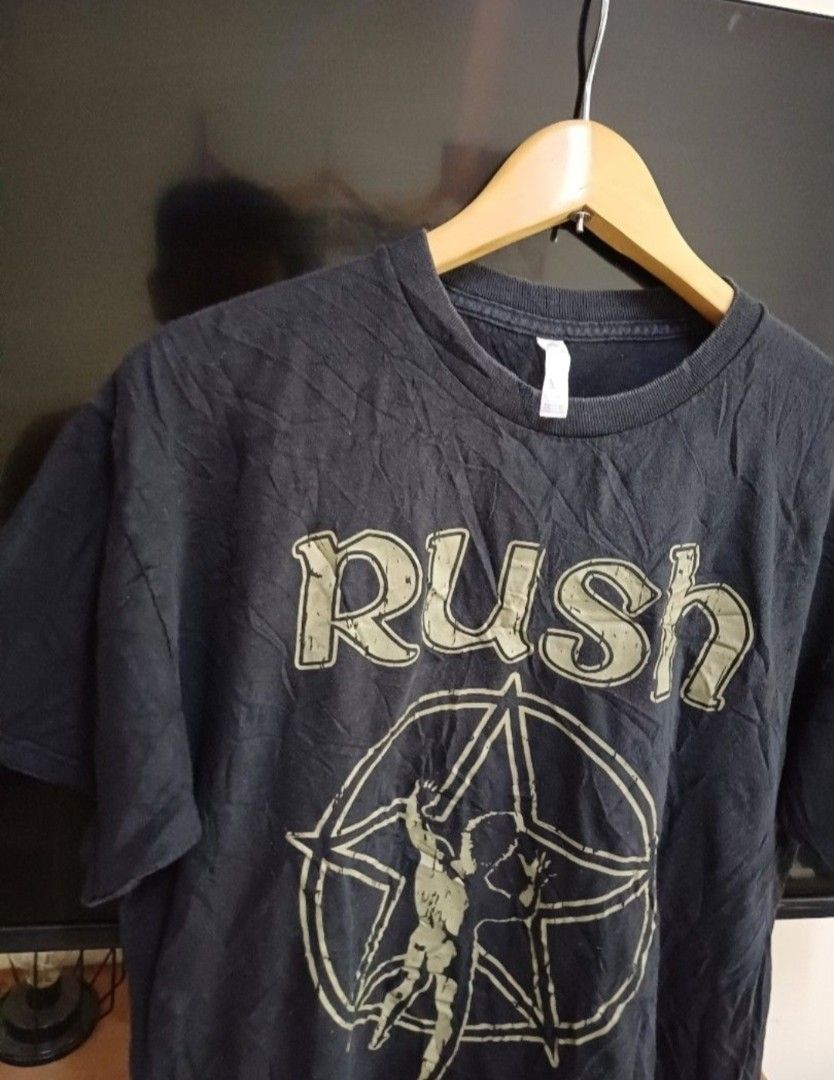 AUTHENTIC RUSH BAND SHIRT (Category: Activewear) located in Manila. Submitted by bvnnie (Listing ID 1466685723, Image 2). Description: AUTHENTIC RUSH BAND SHIRT Actual size using inches Armpit to Armpit/Widht 22 Lenght/27 fittings is Large Excellent Condition, Issue:minimal bleach stain sa back near herm Message if you have any other question about sizing. We do shipping nation wide I'm also open for video call so that you can see the item you 'r