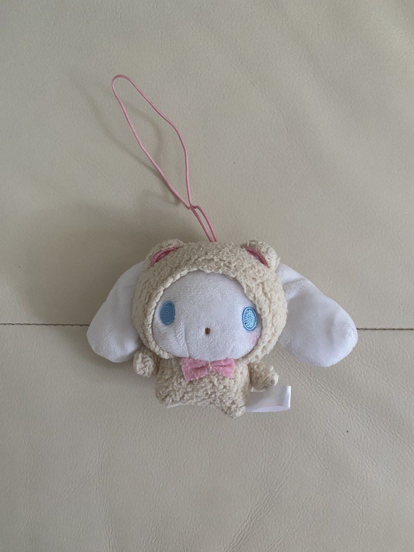 AUTHENTIC Sanrio Cinnamoroll Plush Keychain (Category: Plushies & Soft Toys) located in Cebu City. Submitted by hailey_sells (Listing ID 1466595653, Image 1). Description: - Authentic Cinnamoroll plush keychain - Dressed in an adorable, fluffy beige sheep costume with a pink bow tie - Big floppy white ears and soft texture all over - Equipped with a convenient pink strap for bags or keys.