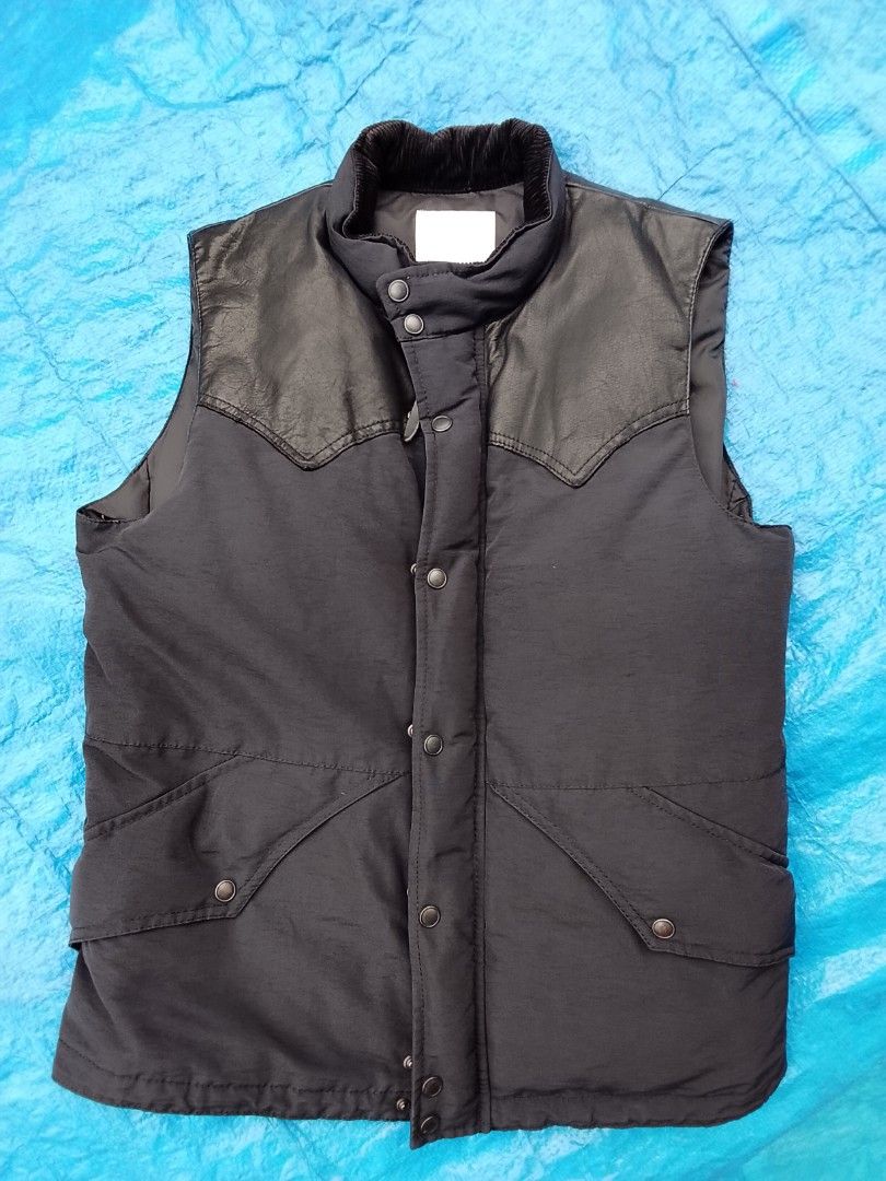 Authentic Takeo Kikuchi down vest (Puffer vest) (Category: Vests) located in Manila. Submitted by newage.vintage (Listing ID 1466661860, Image 1). Description: - brand: Takeo Kikuchi - materials: 90% down, 10% feather, - corduroy collar, genuine leather shoulder yoke - hardware: Ykk zipper - Style: outdoor / workwear down vest - excellent condition -Dimes 28X22 - negotiable price - 2 pockets on front, and 2 pockets inside.