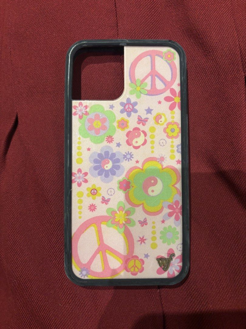 Authentic Wildflower iPhone 12 Case (Category: Cases & Sleeves) located in Muntinlupa City. Submitted by shigglegitter27 (Listing ID 1466721244, Image 1). Description: gorgeous pink design, rusted logo but can be cleaned!! og from urban outfitters usa.