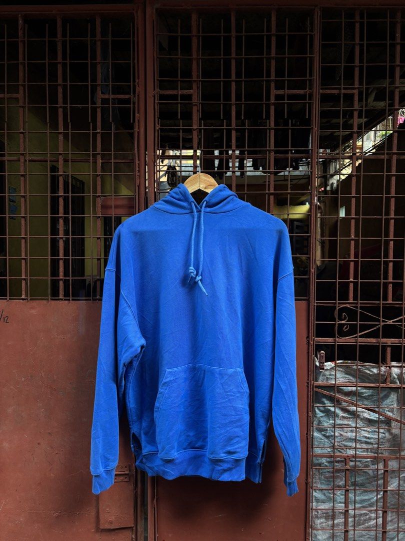 Balenciaga Blue Hooded Sweatshirt (Category: Hoodies) located in Manila. Submitted by thriftkibs (Listing ID 1466716199, Image 2). Description: - Authentic Balenciaga hoodie in vibrant blue - Size S with clear tag details and product codes - Bold white logo printed on the back - Classic pullover with drawstring hood and kangaroo pocket - Crafted in Portugal from premium cotton French terry - Clean and ready to wear condition.