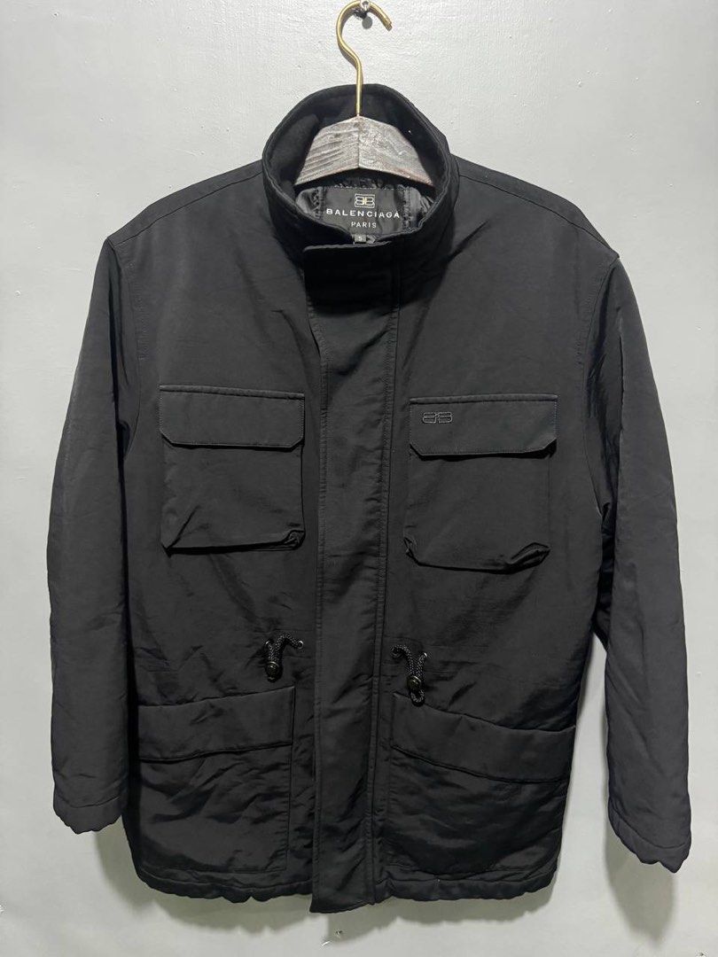 Balenciaga Paris Black Utility Jacket Size 5 (Category: Coats, Jackets and Outerwear) located in Marikina City. Submitted by anndergroundmarket (Listing ID 1466566963, Image 1). Description: - Brand: Balenciaga Paris - Color: Black - Size: 5 / 180/92A - Material: 78% cotton, 22% polyamide shell with 100% polyester lining - Design: Multiple chest and lower front flap pockets, stand collar, and full front zip - Fit: Adjustable drawstrings at the wa