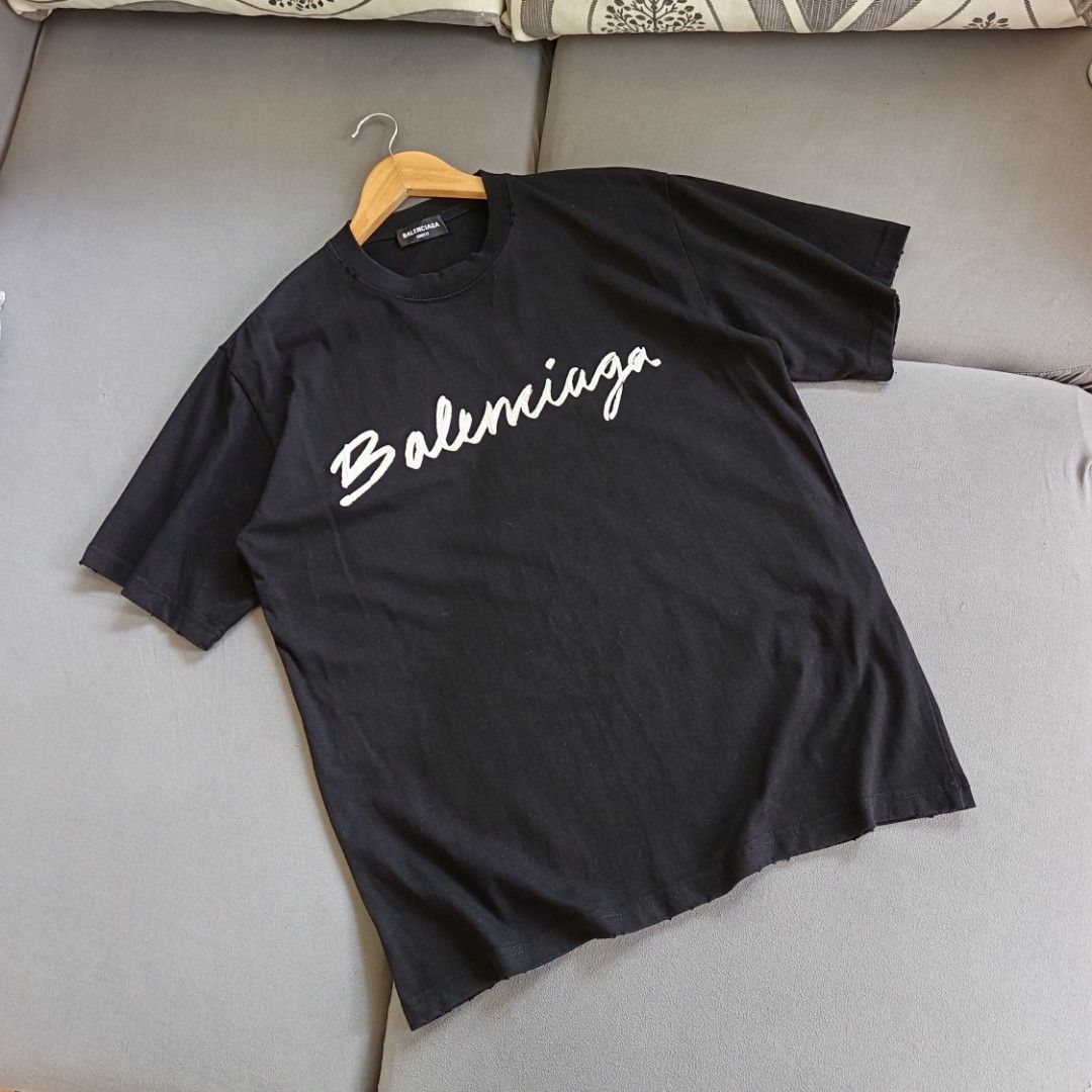 Balenciaga Script Logo Distressed Tee (Category: Luxury Apparel) located in Banaue. Submitted by radical.thrift (Listing ID 1466688008, Image 1). Description: Balenciaga Script Logo Distressed Tee small on tag, oversized fits large (21.5W 28L) good as new condition ₱1K+sf.