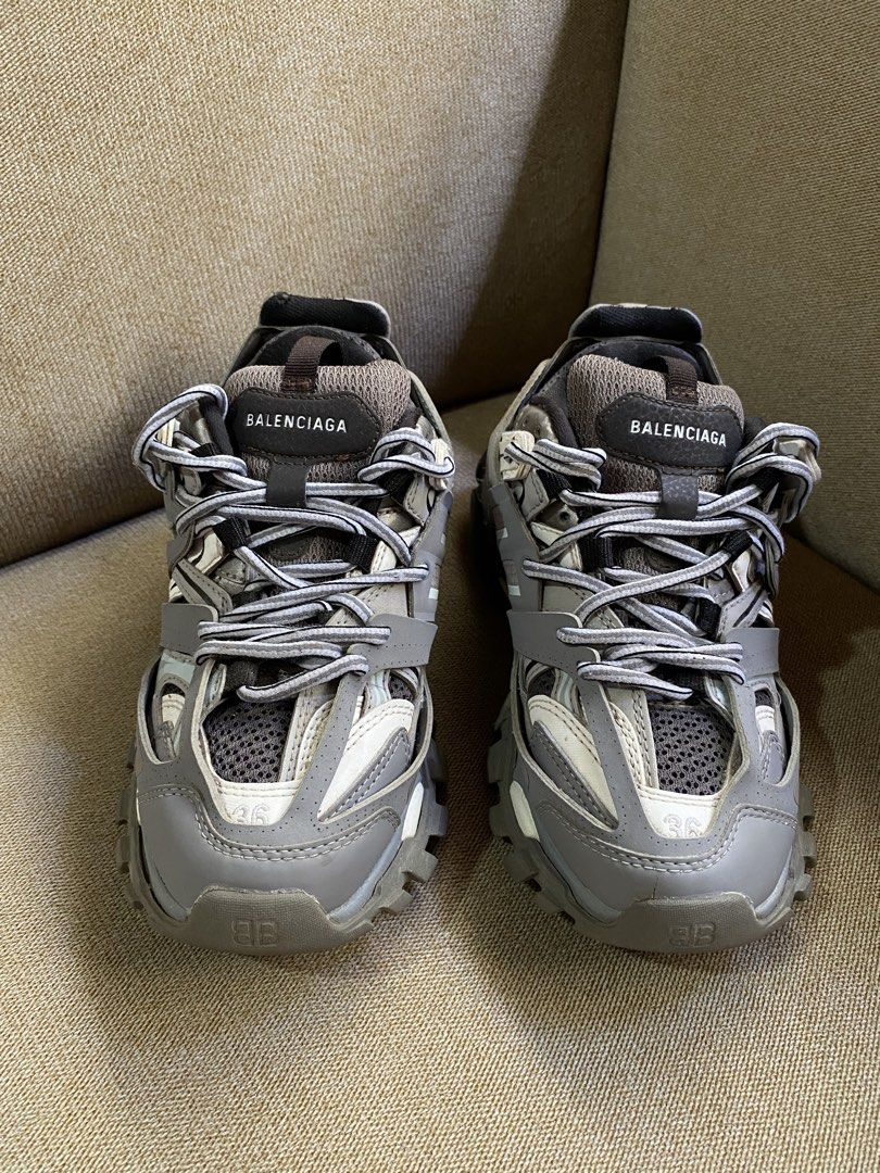 Balenciaga Track (Category: Sneakers) located in Bayugan. Submitted by reymarcastro56 (Listing ID 1466618458, Image 3). Description: - Brand: Balenciaga - Model: Track Sneakers - Colorway: Grey, White, and Black - Size: EU 36 (embossed on toe) - Design: Chunky multi-panel build with mesh and nylon overlays - Details: Balenciaga branding on side and tongue, track logo on back pull tab - Laces: Original grey and white woven laces - Condition: Rubbe