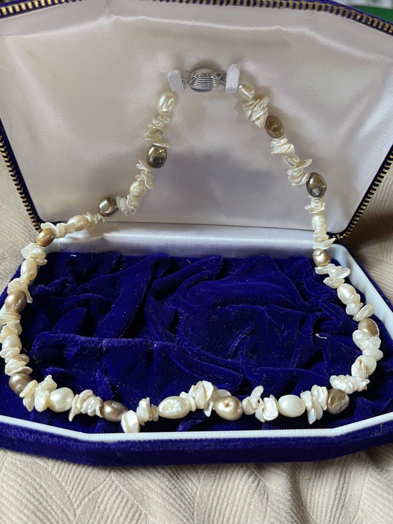 Freshwater Pearl Necklace with Clasp (Category: Necklaces) located in Tandag. Submitted by maryarlale42144 (Listing ID 1466568087, Image 1). Description: - Type: Multicolor baroque freshwater pearl necklace - Colors: Mix of white, cream, and bronze tones - Shapes: Unique irregular nugget and potato shapes - Clasp: Detailed silver-tone metal clasp for secure wear - Condition: Brand new and carefully stored.
