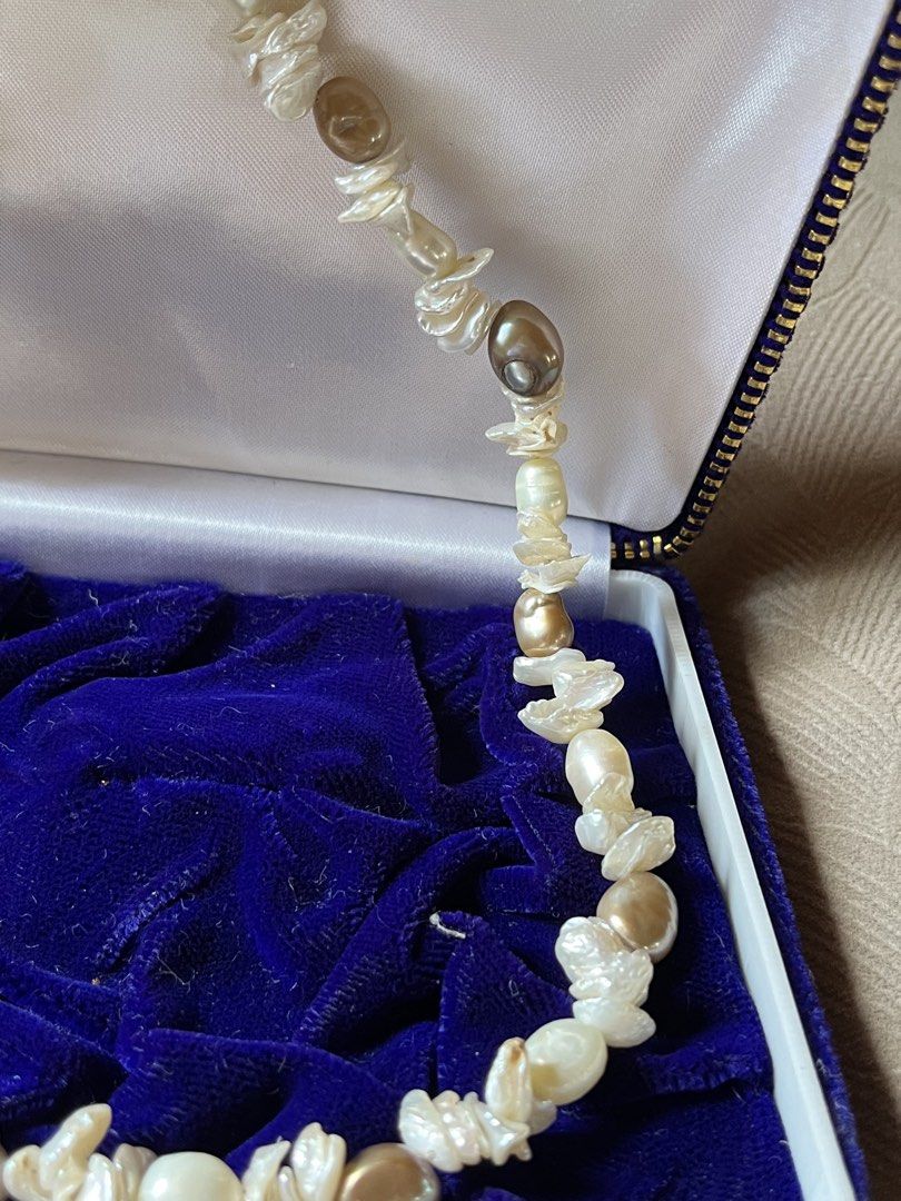 Freshwater Pearl Necklace with Clasp (Category: Necklaces) located in Tandag. Submitted by maryarlale42144 (Listing ID 1466568087, Image 2). Description: - Type: Multicolor baroque freshwater pearl necklace - Colors: Mix of white, cream, and bronze tones - Shapes: Unique irregular nugget and potato shapes - Clasp: Detailed silver-tone metal clasp for secure wear - Condition: Brand new and carefully stored.