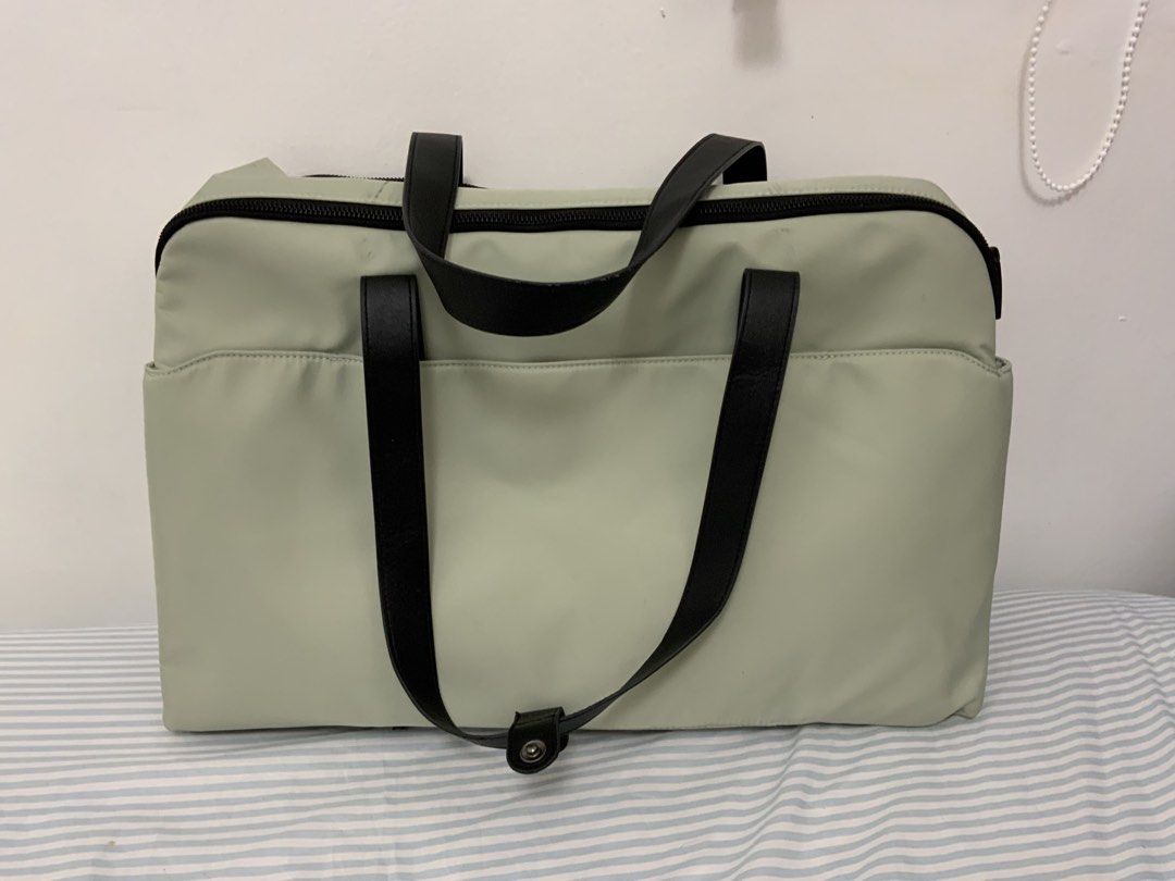 Bash Large Weekender Bag in Sage (Category: Tote Bags) located in Bacoor. Submitted by lavanderpeach (Listing ID 1466596003, Image 3). Description: - in Large size - has minimal stains (mostly from the leather handle 🥲) (pls manage your expectations) - comes with its original pouch and plastic packaging - 3x used; rfs - will buy the new smaller version - Payment first via e-wallet/bank transfer - Pick up at my house (Molino IV) or via lalamove c
