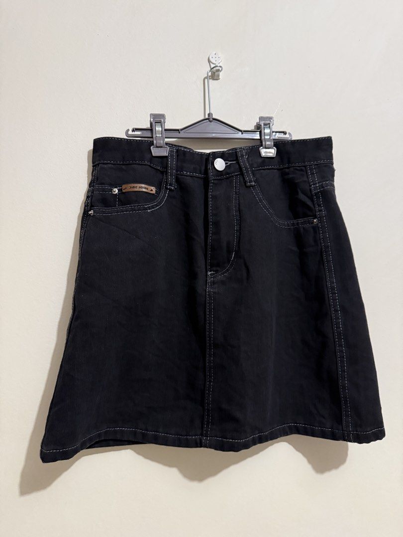 Basic House Black Denim Skirt (Category: Skirts) located in San Fernando. Submitted by richeloy (Listing ID 1466569661, Image 1). Description: Black denim skirt from Basic House. Contrast white stitching, front button and zip fly. Two front pockets with a small branded leather patch on the right pocket. A-line shape, mid-thigh length. Heavy cotton fabric, structured feel. Versatile piece for casual outfits..