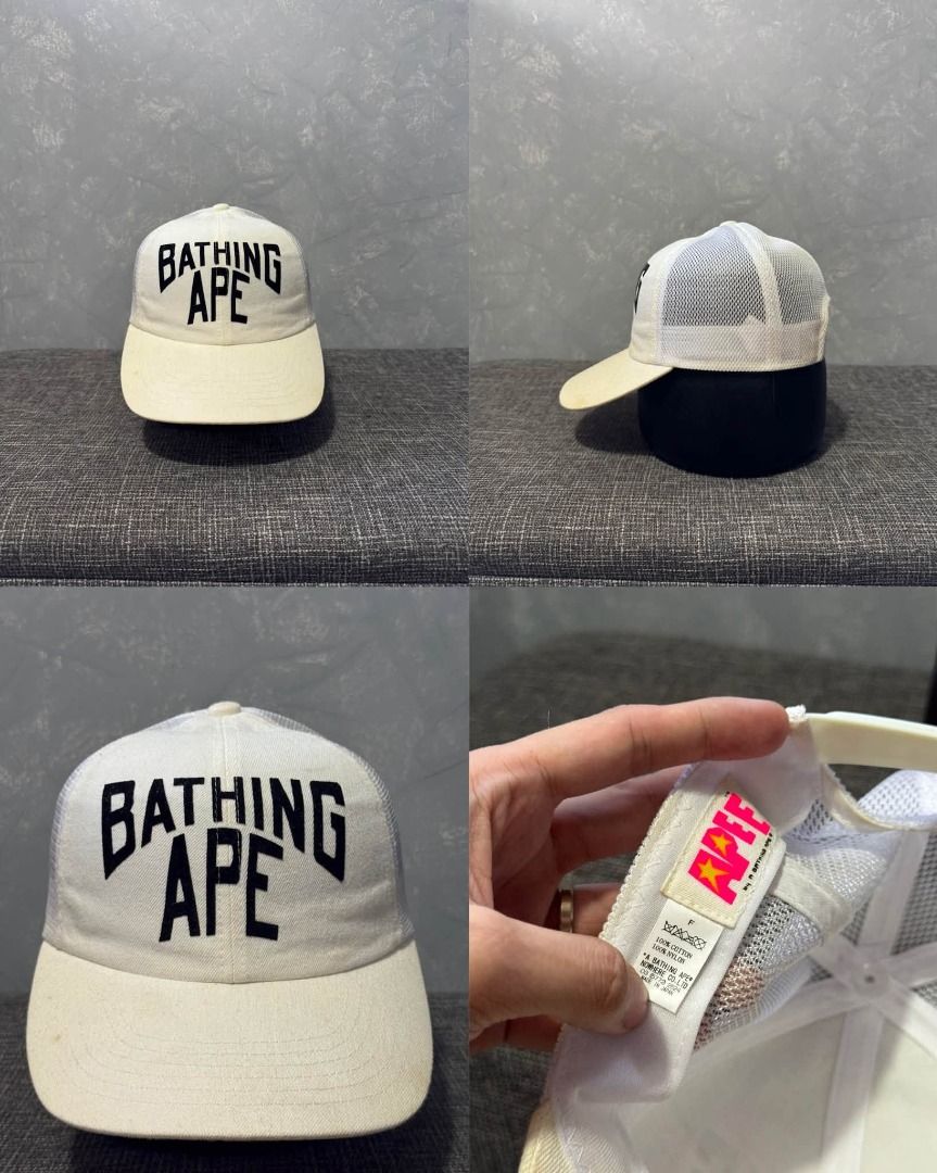 Bathing Ape Trucker Hat White Black (Category: Caps & Hats) located in Baguio. Submitted by stockedclothing047 (Listing ID 1466745662, Image 1). Description: BAPE FELT BRINT SCRIPT TRUCKER HAT (VGOOD - EXCELLENT CONDITION) NOTE* NEEDS LIGHT WASH ONE SIZE FITS ALL - Brand: A Bathing Ape (BAPE) - Item: White trucker hat with bold black embroidered front lettering - Features: Breathable mesh back, clean off-white front brim, and adjustable snapback 