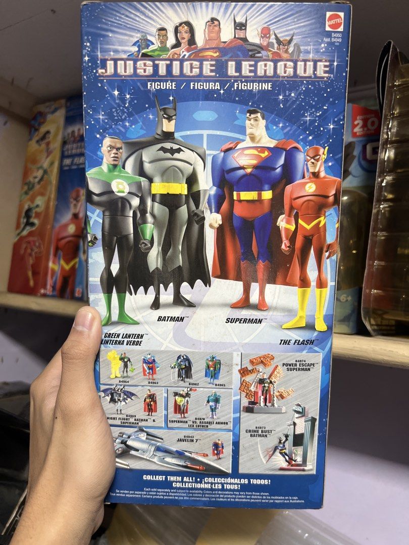 Batman — Mattel Justice League 10” Action Figure (Category: Figurines & Statues) located in Quezon City. Submitted by thegroovearchive (Listing ID 1466679068, Image 2). Description: - Character: Mattel Justice League Batman Action Figure - Size: Stands 10 inches (~25 cm) tall - Design: Classic grey suit with black cowl, cape, and yellow utility belt - Condition: Brand new, unopened packaging (shows minor shelf wear) - Collector's Note: Back of th