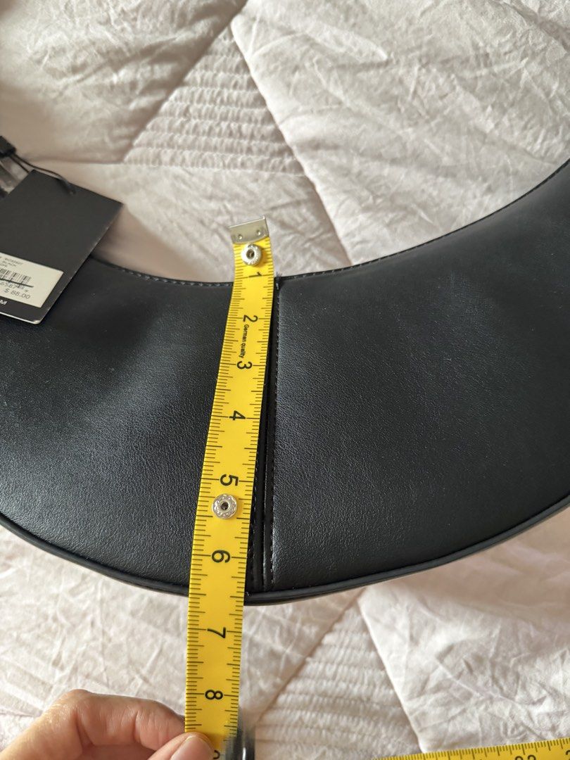 BCBG Black Crescent Shoulder Bag (Category: Shoulder Bags) located in Taytay. Submitted by gvccloset (Listing ID 1461601097, Image 3). Description: - Brand: BCBG - Style: Crescent Shoulder Bag - Color: Black - Size: One Size (O/S) - Original MSRP: $88.00 - Features: Unique curved shape, single strap - Bought in USA .
