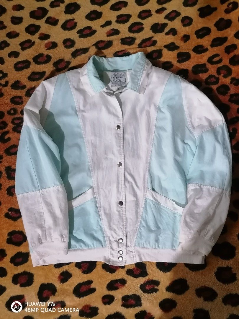 Be in the Current Seen vintage color block jacket (Category: Coats, Jackets and Outerwear) located in Naga. Submitted by mrwisethrifter (Listing ID 1466574117, Image 1). Description: - Brand/Style: Vintage Be in the Current Seen color block jacket - Color: White and pastel blue panels - Size: Medium - Material: 100% cotton shell, nylon sleeve and body lining - Features: Front snap buttons and functional pockets - Origin: Made in Egypt - Care: Mac