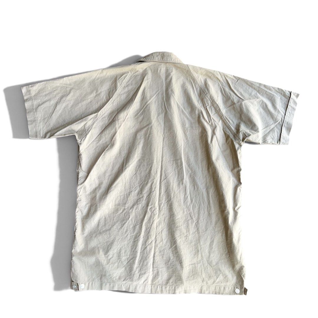 Beams Open Collar Camp Utility Shirt Beige (Category: Formal Shirts) located in Binan City. Submitted by ronsanchez (Listing ID 1466576897, Image 3). Description: Beams Open Collar Camp Utility Shirt Beige Very minimal sign of wear. Excellent Condition. Open camp collar (Cuban collar) that features a relaxed, flat-laying neckline. Two large, lower utility patch pockets positioned near the bottom hem, both secured with button-down flaps Lightweigh
