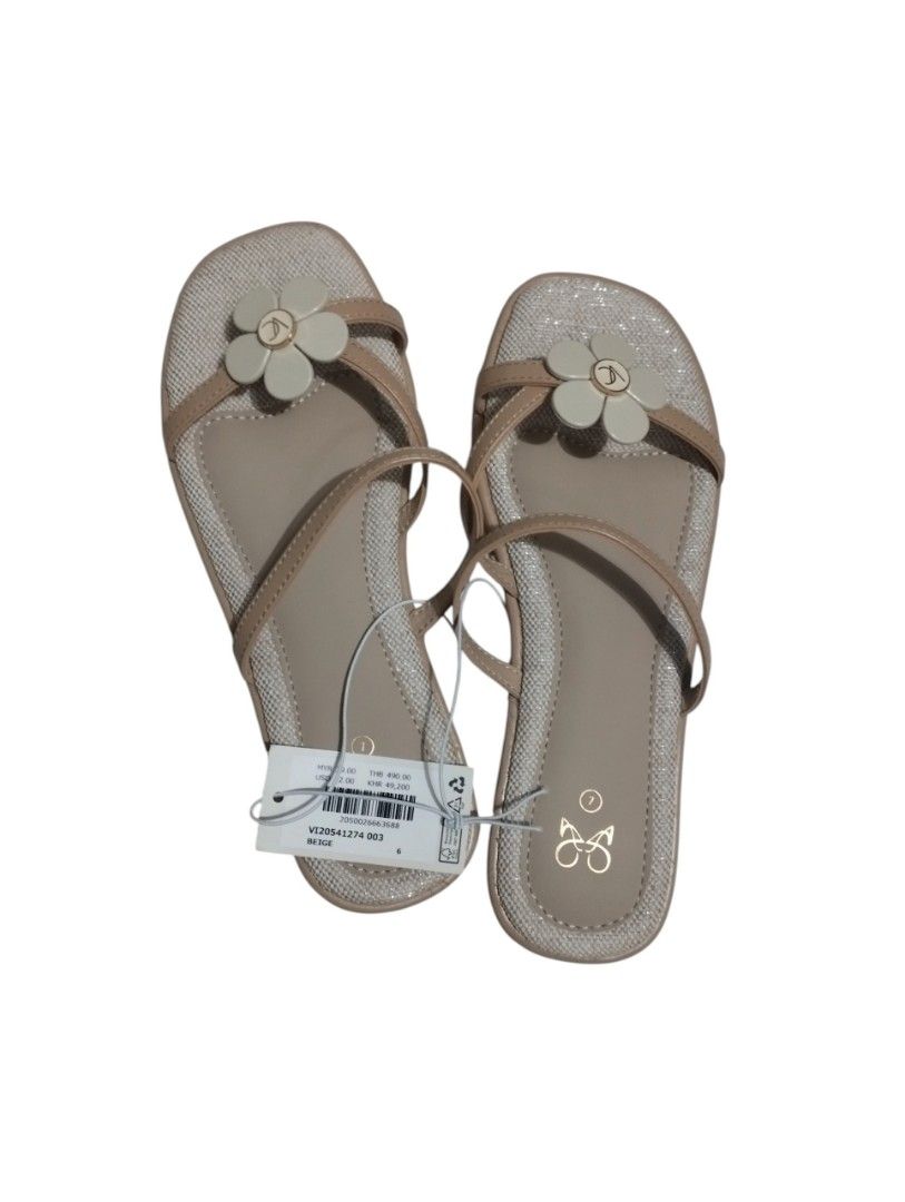 Beige Floral Strappy Flat Sandals Size 7 (Category: Flats & Sandals) located in Manila. Submitted by nikaclyde (Listing ID 1466594948, Image 1). Description: - Brand new with original store tags - Size: 6 - Color: Neutral beige (goes with any summer outfit) - Design: Strappy flat sandals with cute white flower charm - Features: Easy slip-on style and stylish glittery trim around the edges.