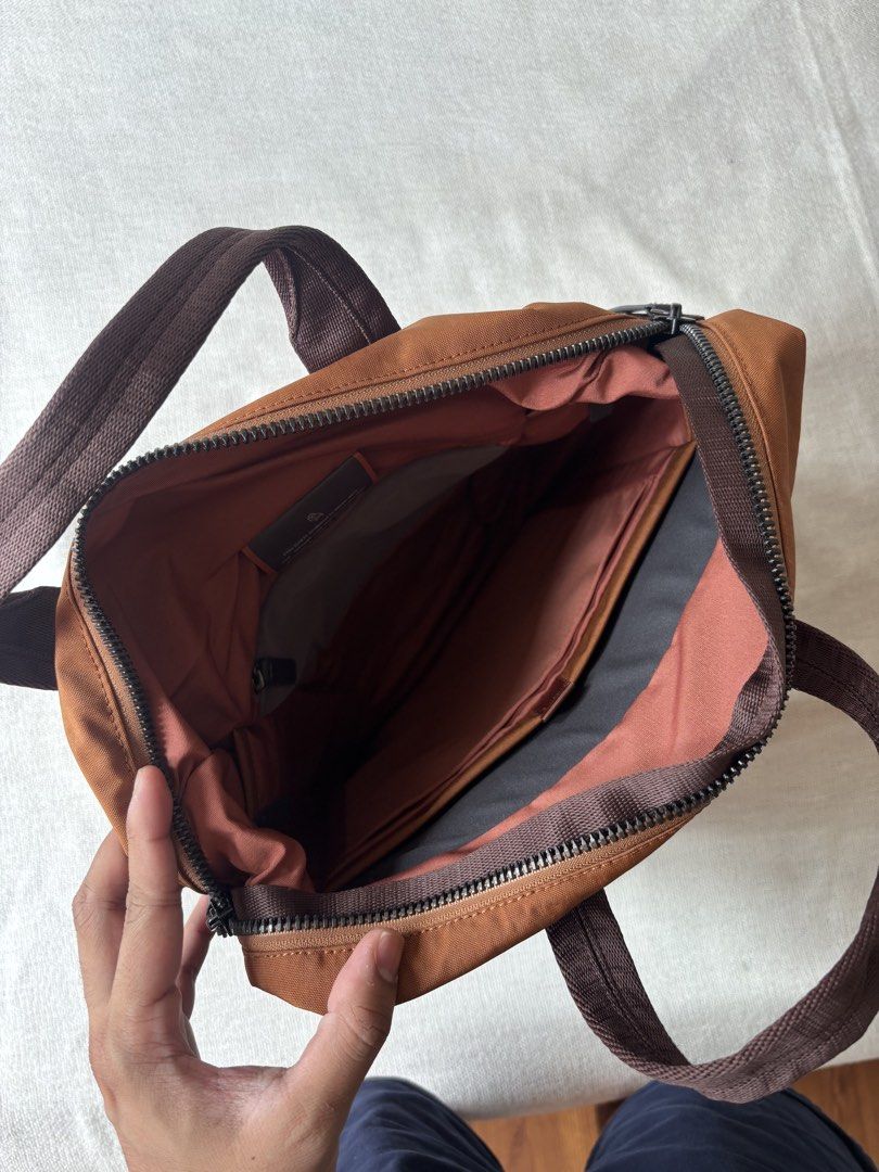 Bellroy Tokyo Totepack 20L Backpack (Category: Backpacks) located in Pasay City. Submitted by jerichomontellano (Listing ID 1466599685, Image 3). Description: - Brand: Bellroy Tokyo Totepack - Color: Bronze - Capacity: 20 Liters - Dual functionality: Converts seamlessly from a tote bag to a backpack - Comfort features: Top grab handles and adjustable back shoulder straps - Main compartment: Wide-opening zipper for easy access - Storage: Built-in 