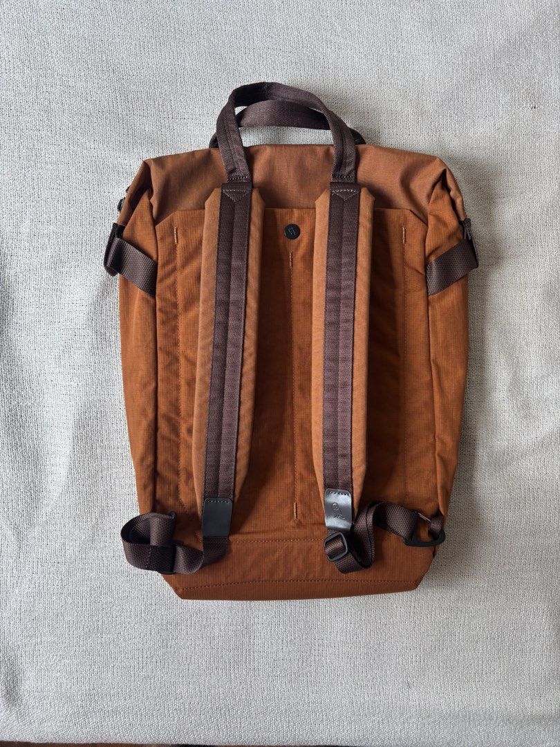 Bellroy Tokyo Totepack 20L Backpack (Category: Backpacks) located in Pasay City. Submitted by jerichomontellano (Listing ID 1466599685, Image 2). Description: - Brand: Bellroy Tokyo Totepack - Color: Bronze - Capacity: 20 Liters - Dual functionality: Converts seamlessly from a tote bag to a backpack - Comfort features: Top grab handles and adjustable back shoulder straps - Main compartment: Wide-opening zipper for easy access - Storage: Built-in 