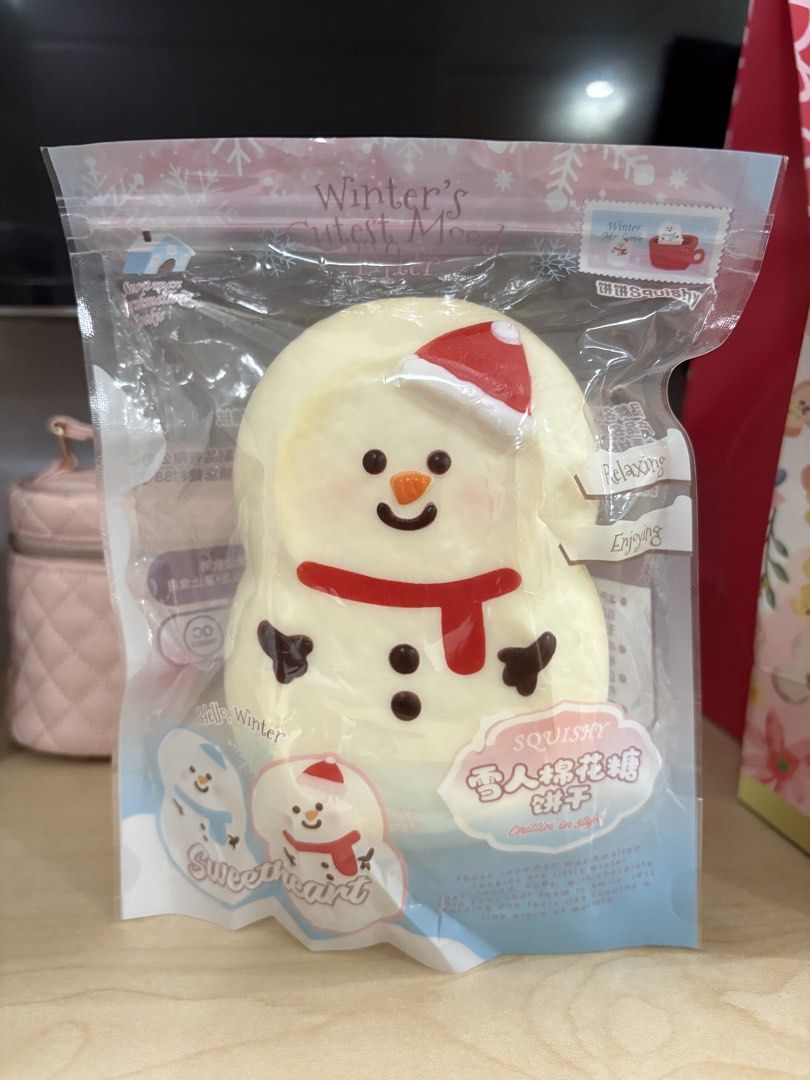 BingBing Snowman Squishy Toy Winter Theme Package (Category: Designer & Blind Box Toys) located in Manila. Submitted by hershchoco (Listing ID 1466678428, Image 1). Description: - Item: Snowman Squishy Toy with red Santa hat and scarf - Design: Soft marshmallow style with white, red, orange, and black details - Condition: Lightly Used, in original winter-themed plastic packaging - Features: Great for stress relief, fidgeting, or as a cute collect