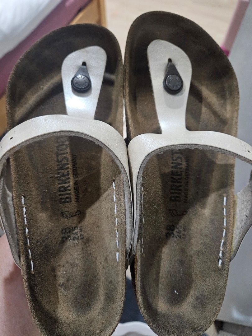 Birkenstock Gizeh Sandals (Category: Flats & Sandals) located in Manila. Submitted by snugglebug04 (Listing ID 1466700668, Image 1). Description: - Brand: Birkenstock - Model: Gizeh Thong Sandals - Color: White - Size: 38 (Regular Width) - Origin: Made in Germany - Condition: Pre-loved with noticeable dark discoloration on the footbeds from regular use - Features: Buckles, straps, and soles are fully intact with plenty of tread remaining Issue: P