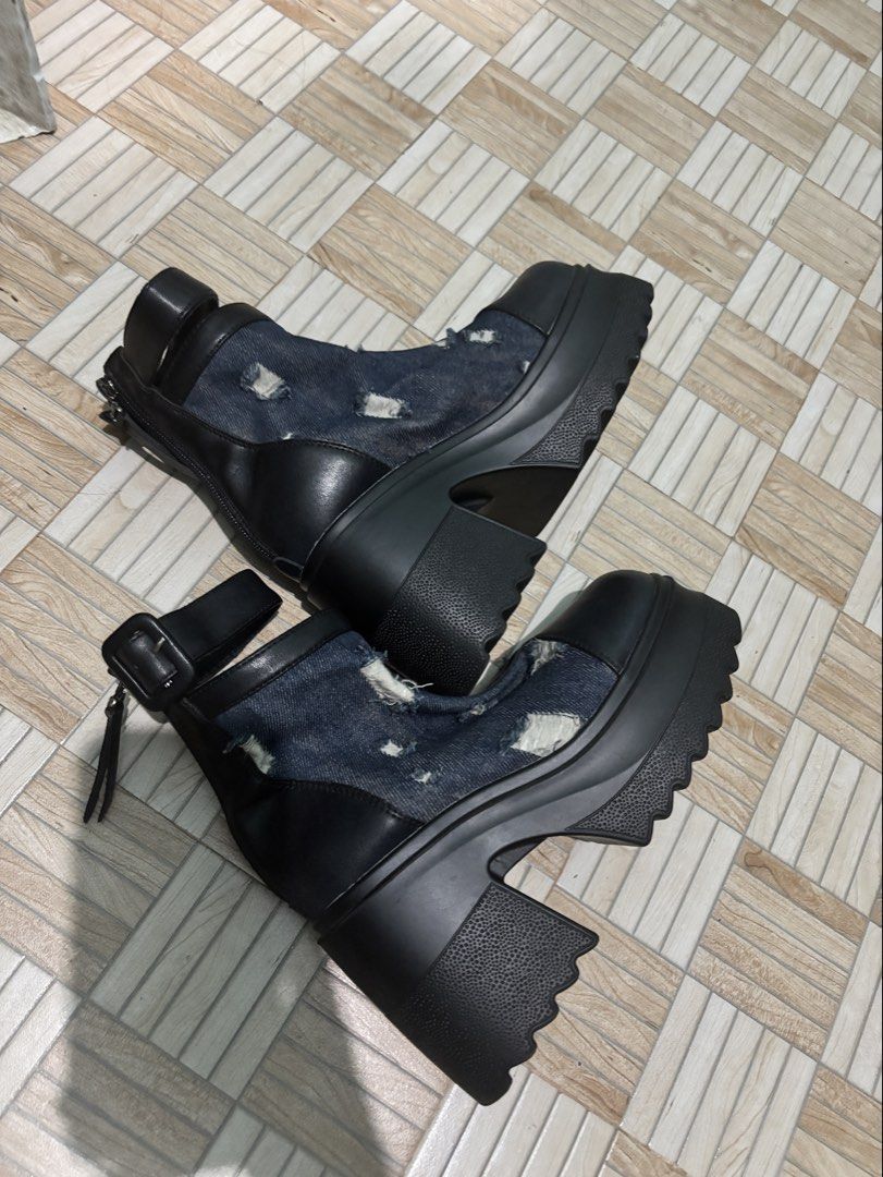 Black and Denim Distressed Chunky Heel Boots (Category: Boots) located in Las Pinas. Submitted by leleqt_ (Listing ID 1466745487, Image 2). Description: - Style: Edgy chunky boots with distressed denim panels - Design: High heels, platform soles, and top strap with buckle detail - Convenience: Back zippers for easy on and off -Once lang na use sa concert. - 3 inches heels -Size 36 .