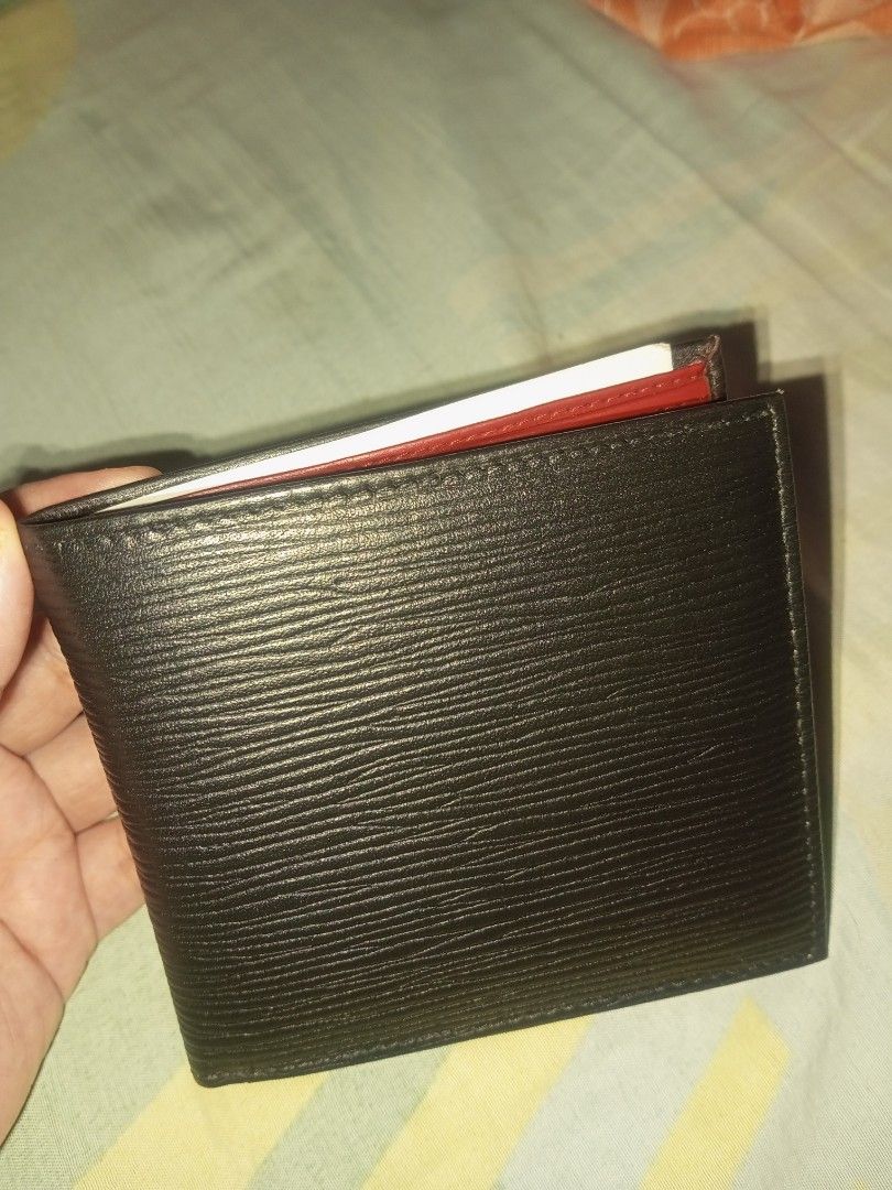 Black and Red Bi-fold Leather Wallet (Category: Wallets & Card Holders) located in Manila. Submitted by preloved119 (Listing ID 1466592339, Image 1). Description: - Style: Minimalist bi-fold wallet - Exterior: Premium black textured leather - Interior: Eye-catching bright red lining - Storage: Multiple card slots on both sides and a clean top bill compartment - Design: Slim profile, pocket-friendly - Condition: Brand new - Shipping: Fast shipping
