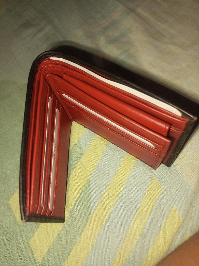Black and Red Bi-fold Leather Wallet (Category: Wallets & Card Holders) located in Manila. Submitted by preloved119 (Listing ID 1466592339, Image 3). Description: - Style: Minimalist bi-fold wallet - Exterior: Premium black textured leather - Interior: Eye-catching bright red lining - Storage: Multiple card slots on both sides and a clean top bill compartment - Design: Slim profile, pocket-friendly - Condition: Brand new - Shipping: Fast shipping