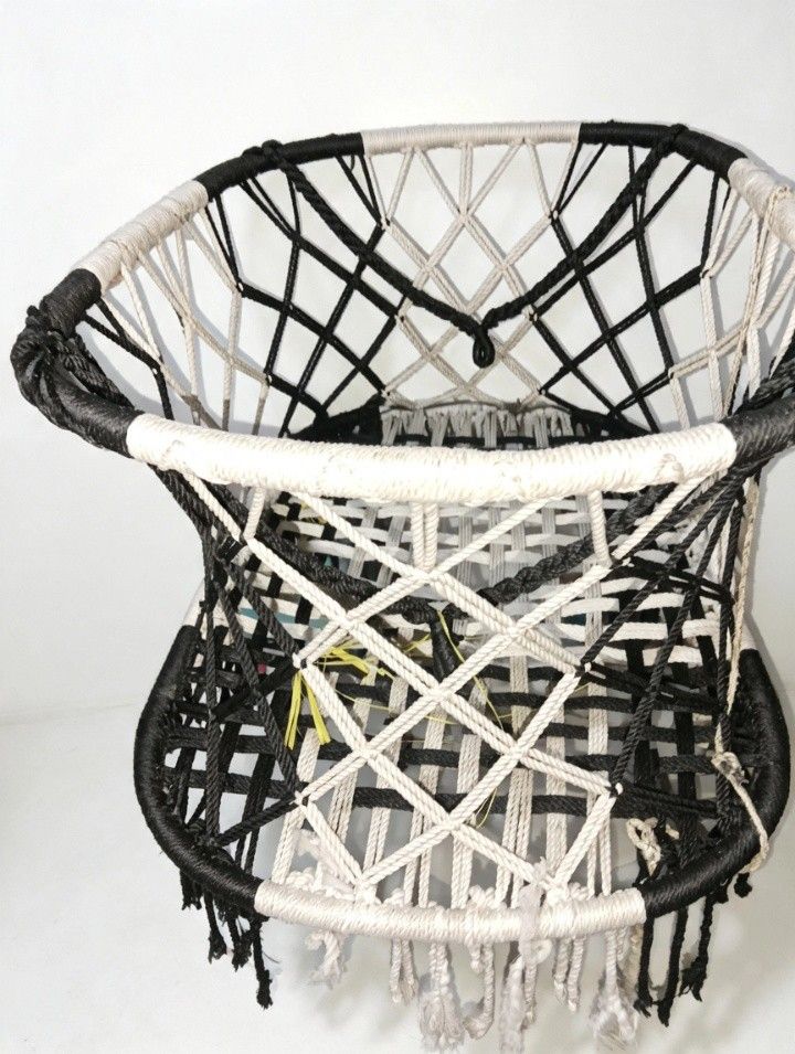 Black and White Macrame Hanging Chair Swing (Category: Babies & Kids Fashion) located in Manila. Submitted by caezxc (Listing ID 1466770483, Image 1). Description: - Handcrafted black and white macrame duyan - Features an intricate woven pattern with stylish fringe tassels - Built on a sturdy metal frame wrapped in durable cotton cord - Provides a cozy and comfortable sleeping experience - Ideal for , bedrooms - Comes ready to hang for easy setup