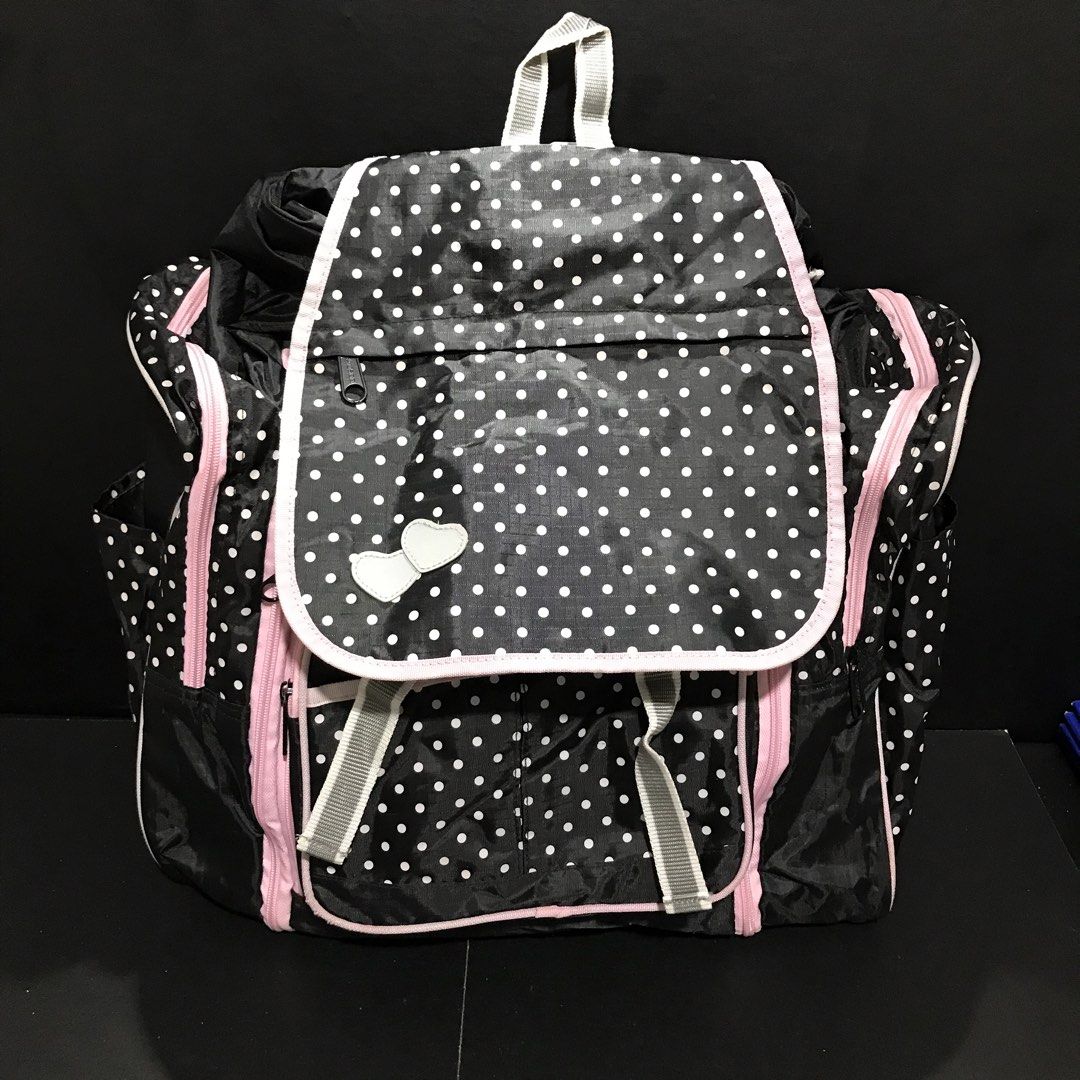 Black and White Polka Dot Backpack with Pink Trim (Category: Backpacks) located in Baao. Submitted by all.things.japan (Listing ID 1466708205, Image 3). Description: 17.0 x 8.0 x 13.0 inches - Stylish black and white polka dot design with cute pink zippers and piping - Secure flap closure featuring a lovely double heart embellishment - Multiple front and side exterior pockets for easy organization - Roomy main compartment to fit all your daily es
