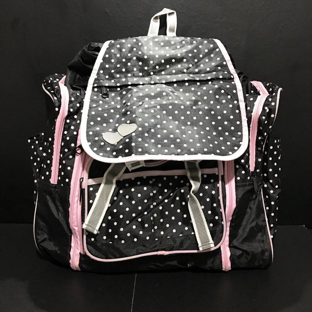 Black and White Polka Dot Backpack with Pink Trim (Category: Backpacks) located in Baao. Submitted by all.things.japan (Listing ID 1466708205, Image 1). Description: 17.0 x 8.0 x 13.0 inches - Stylish black and white polka dot design with cute pink zippers and piping - Secure flap closure featuring a lovely double heart embellishment - Multiple front and side exterior pockets for easy organization - Roomy main compartment to fit all your daily es
