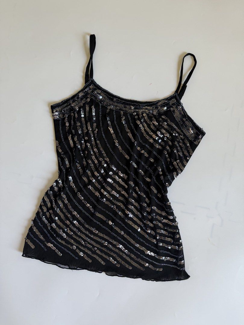 Black Beaded Sequin Camisole Top (Category: Sleeveless) located in Tarlac. Submitted by kr_closet (Listing ID 1466705485, Image 2). Description: - Color: Black with silver sequins and beads - Size: Medium (M) - Design: Elegant diagonal striped beaded and sequined pattern with slim straps - Material: Lightweight mesh fabric with intricate embellishments - Condition: Thrifted, very good pre-loved condition - Perfect for: Night outs, parties, clubs,