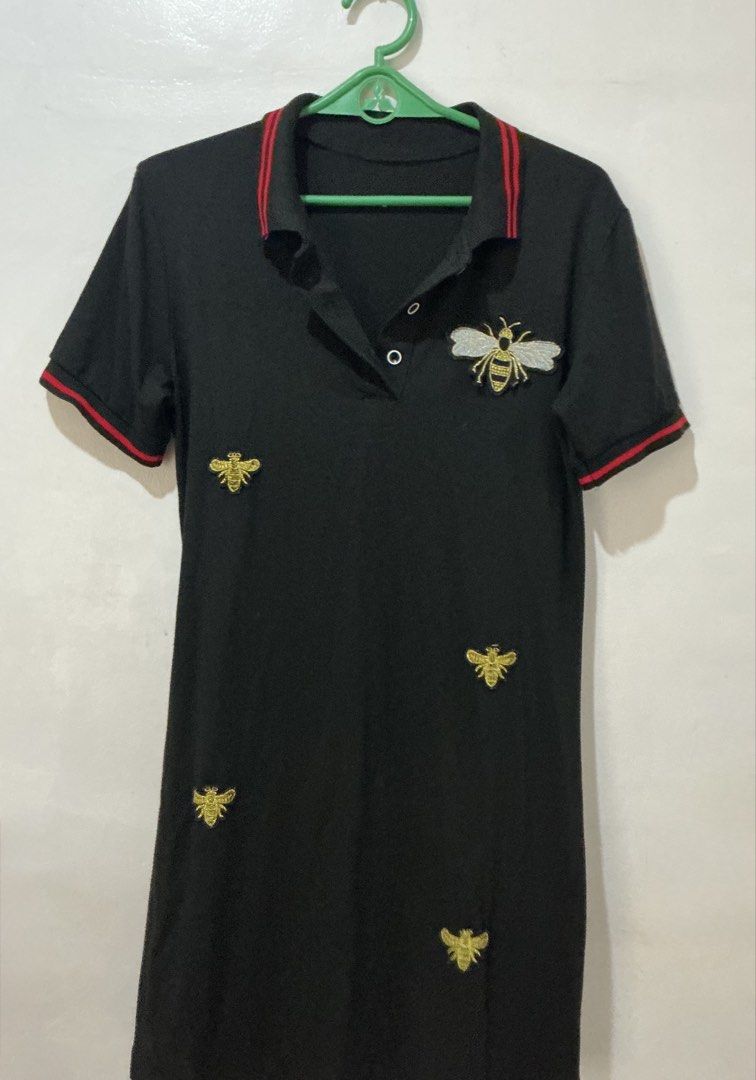 Black Bee Embroidered Polo Dress (Category: Dresses) located in San Pedro. Submitted by itsannabg (Listing ID 1466611577, Image 3). Description: - Color: Black with red stripe accents on the collar and cuffs - Design: Structured collar, 2-button placket, short sleeves - Style: Casual and comfy Can fit S to M.