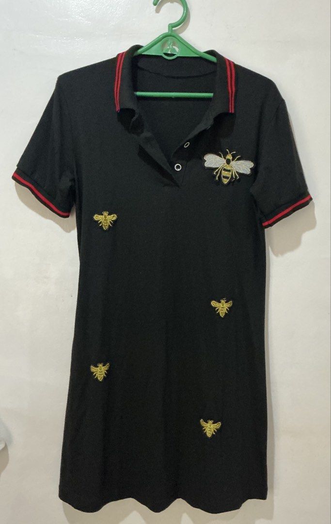 Black Bee Embroidered Polo Dress (Category: Dresses) located in San Pedro. Submitted by itsannabg (Listing ID 1466611577, Image 2). Description: - Color: Black with red stripe accents on the collar and cuffs - Design: Structured collar, 2-button placket, short sleeves - Style: Casual and comfy Can fit S to M.