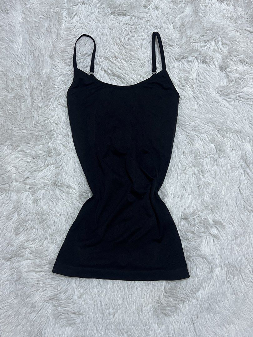 Black Camisole Spaghetti Strap Tank Top (Category: Sleeveless) located in Tuguegarao City. Submitted by love_clothies (Listing ID 1466604374, Image 1). Description: - Color: Classic Black - Fit: Fitted style, hits around the hip - Design: Scoop neckline with adjustable spaghetti straps - Material: Soft and stretchy ribbed knit - Versatility: Essential basic, great for layering or casual wear - Size: Small to Medium.