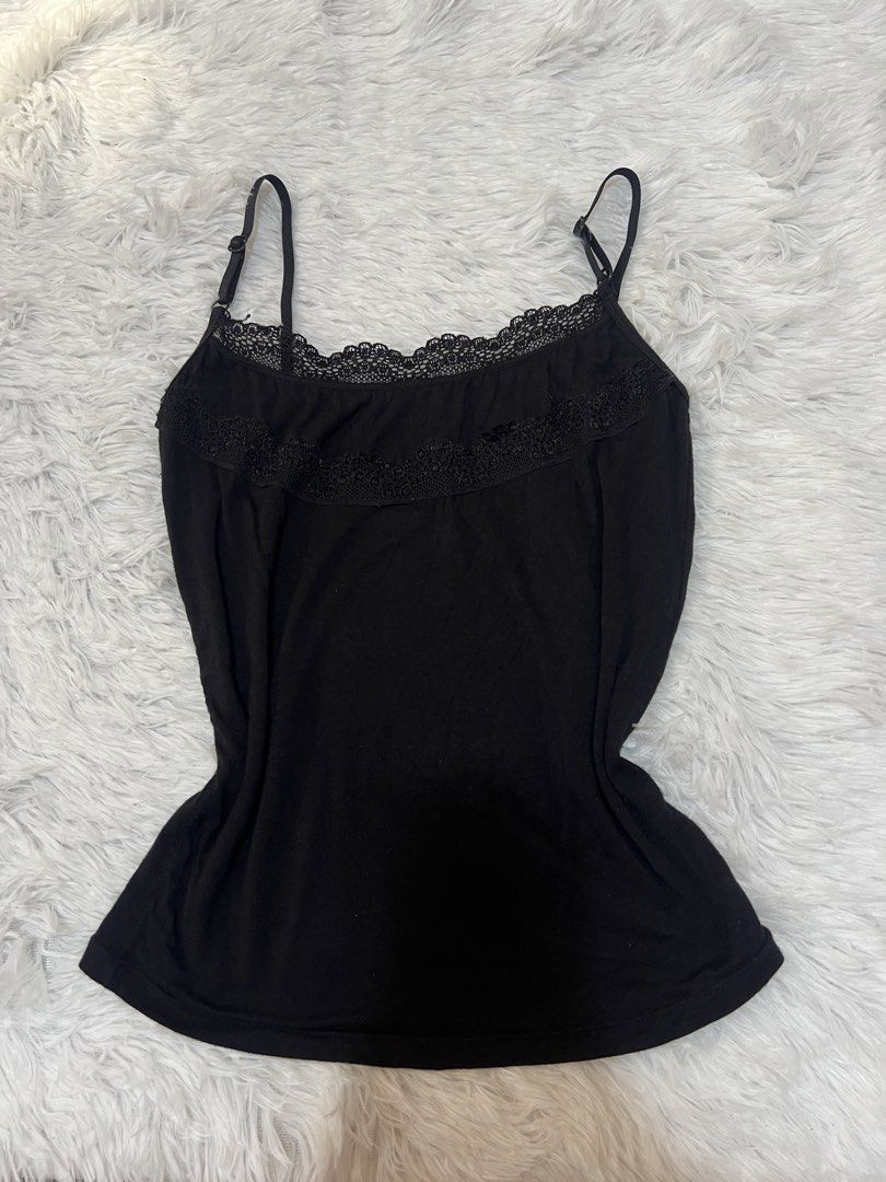 Black camisole with lace trim adjustable straps (Category: Sleeveless) located in Tuguegarao City. Submitted by love_clothies (Listing ID 1466570433, Image 1). Description: - Color: Black - Material: Soft cotton-blend fabric - Details: Delicate lace trim on neckline and upper chest, adjustable spaghetti straps with black hardware - Fit: Fitted silhouette - Condition: Good, ready to wear - Note: Measurements available upon request - Can fit to Sma