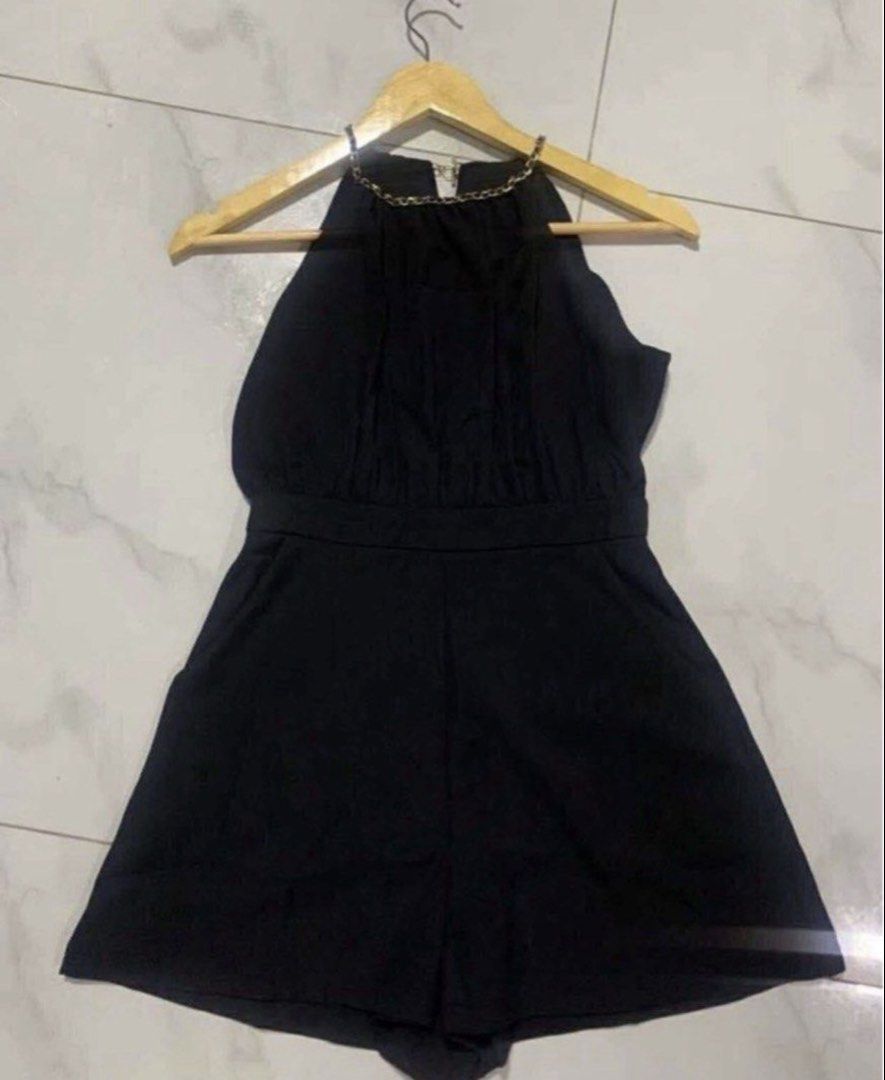 Black Halter Neck Chain Romper Playsuit (Category: Rompers) located in Manila. Submitted by decluterthings888 (Listing ID 1466588960, Image 3). Description: - Color: Black - Style: Sleeveless halter romper with gold-tone chain strap - Fit: Fitted waist with relaxed shorts - Closure: Back zipper with a small keyhole cutout - Fabric: Soft and comfortable - Condition: Clean, worn only once - Occasion: Great for night outs and parties.